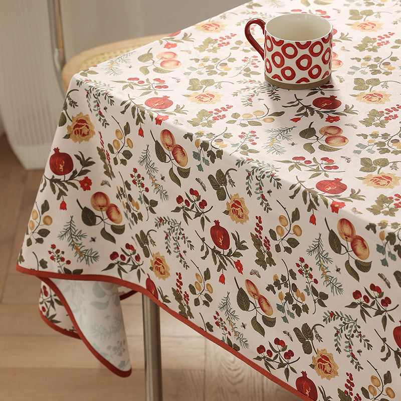 Coated tablecloth in country house style with botanical print and fine hem Stornfield