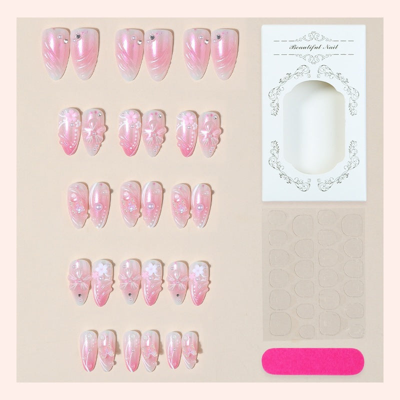 Artificial nail set with sparkling glitter and floral accents Stornfield