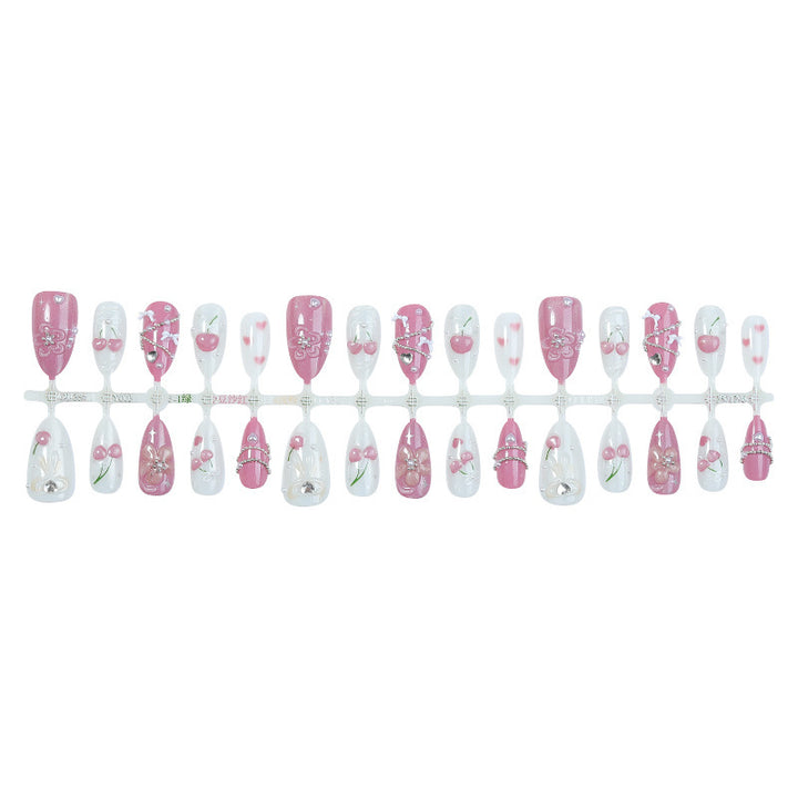 Artificial nail set with decorative floral motifs and glamorous accents Stornfield