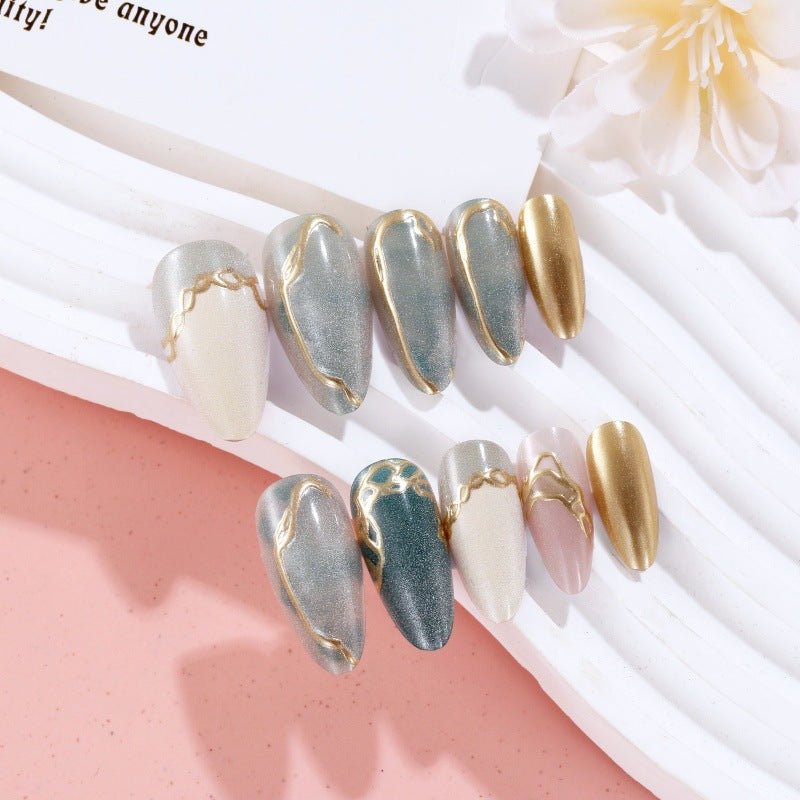 Artificial nails with elegant golden accents Stornfield