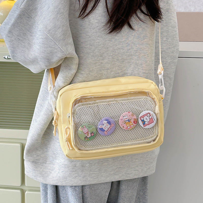 Shoulder bag with transparent viewing pocket and playful graphic design Stornfield