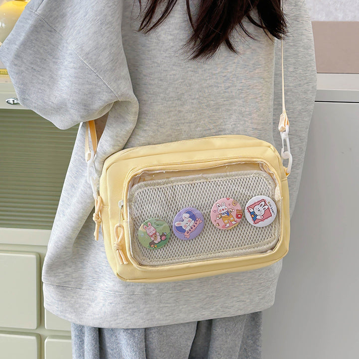 Shoulder bag with transparent viewing pocket and playful graphic design Stornfield