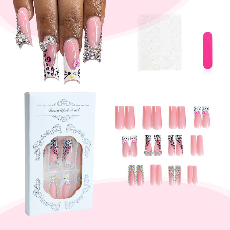 Glamorous artificial nail set with sparkling rhinestone embellishments and creative animal designs Stornfield