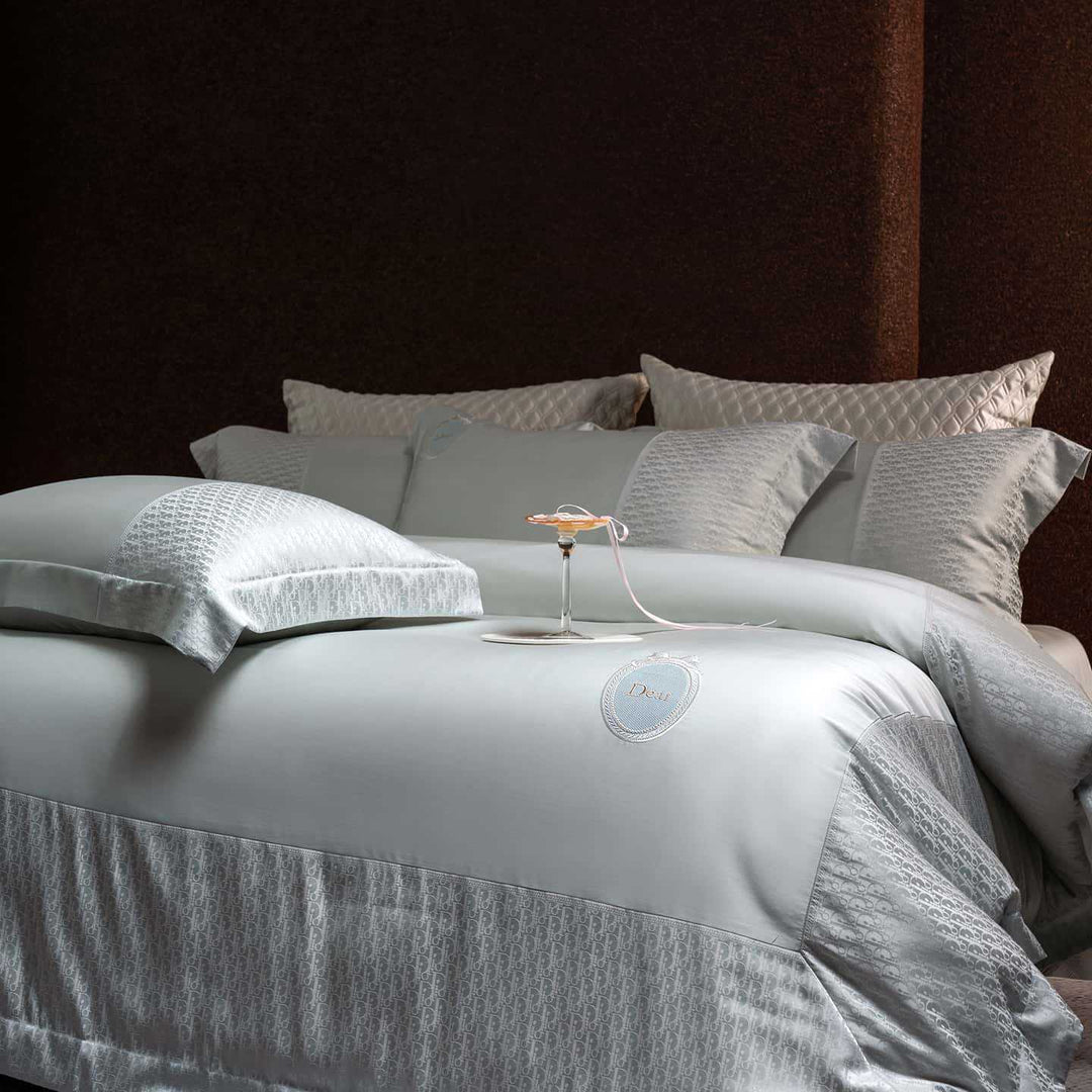 Luxurious satin bedding set with jacquard trim and embroidered coat of arms