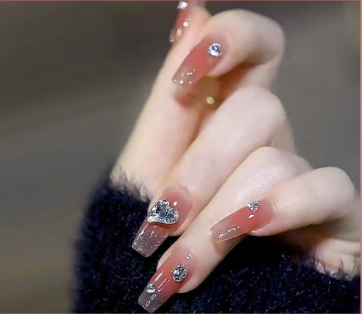 Elegant Nail Art with Glitter and Rhinestones Stornfield