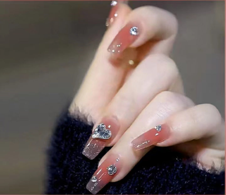 Elegant Nail Art with Glitter and Rhinestones Stornfield