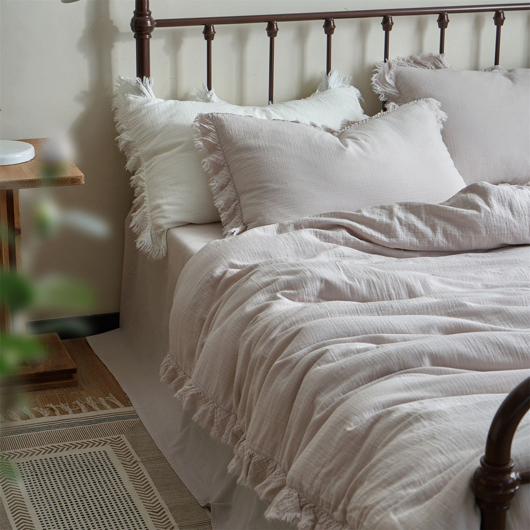 Washed linen bedding set with fringe trim and natural texture