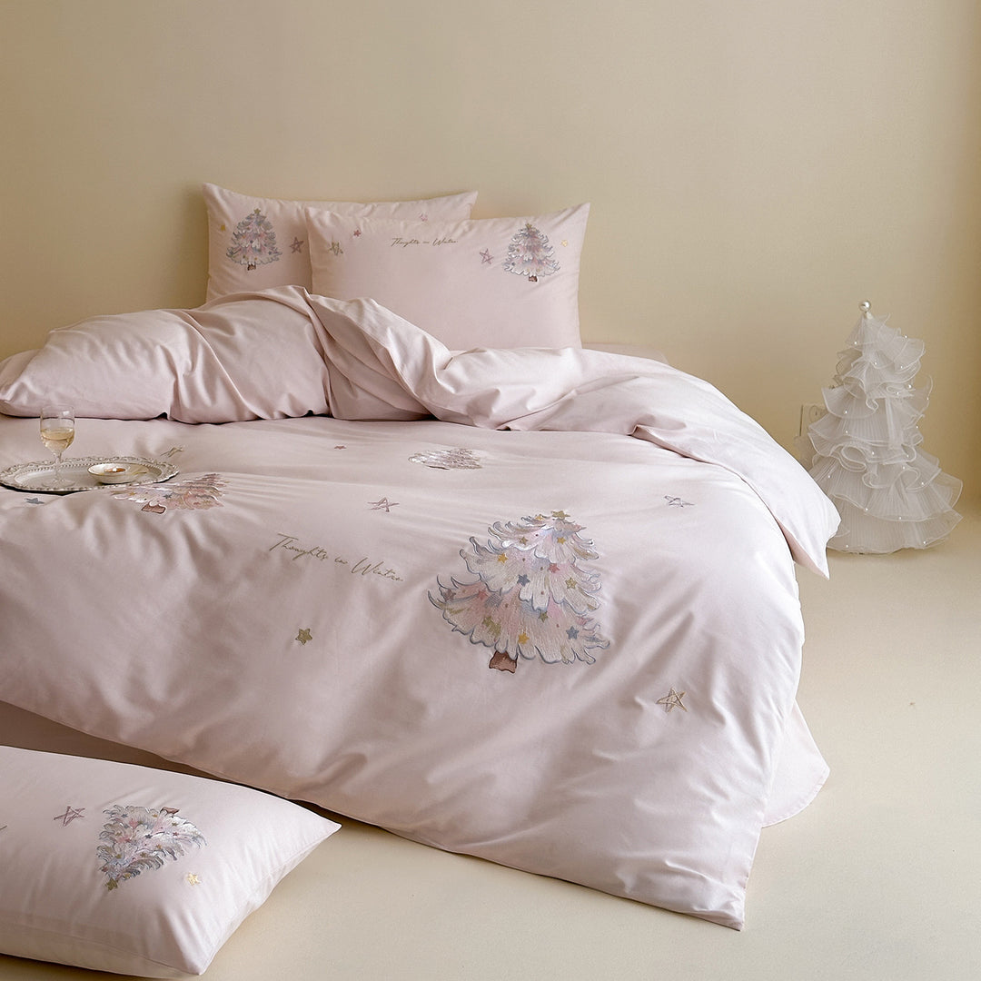 Delicate cotton satin bedding set with pastel embroidered Christmas tree appliqués