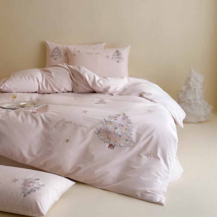 Delicate cotton satin bedding set with pastel embroidered Christmas tree appliqués