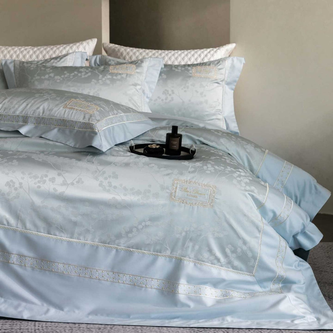 Luxurious satin bedding with jacquard floral pattern and lace trim