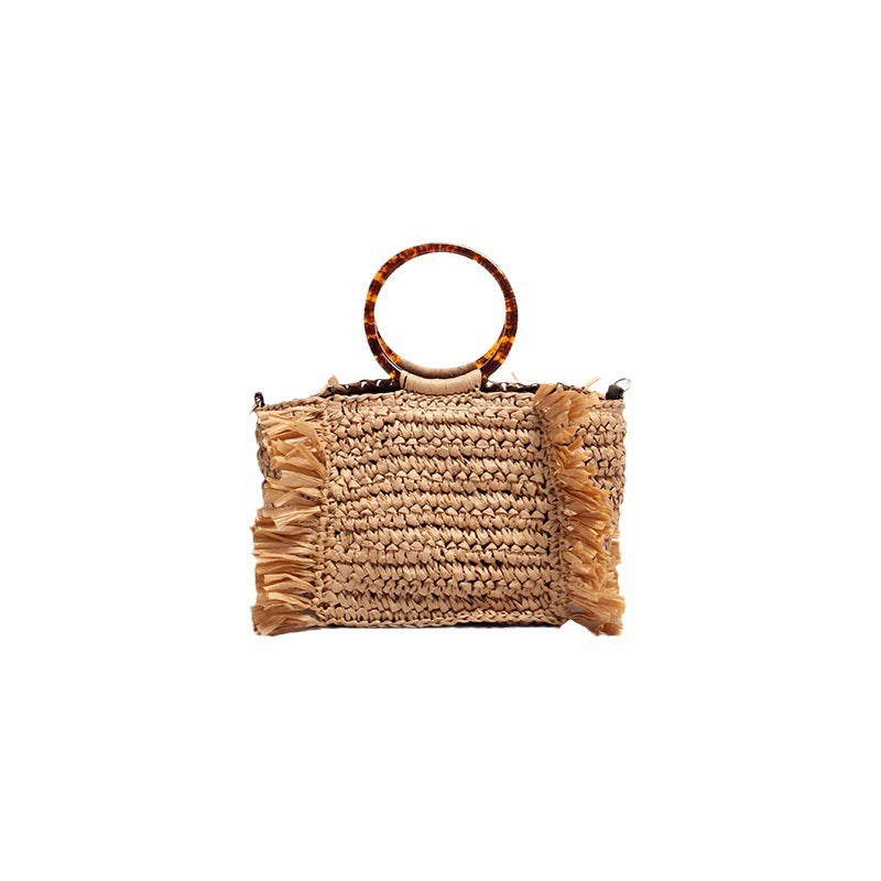 Handmade raffia shoulder bag with fringed accents Stornfield