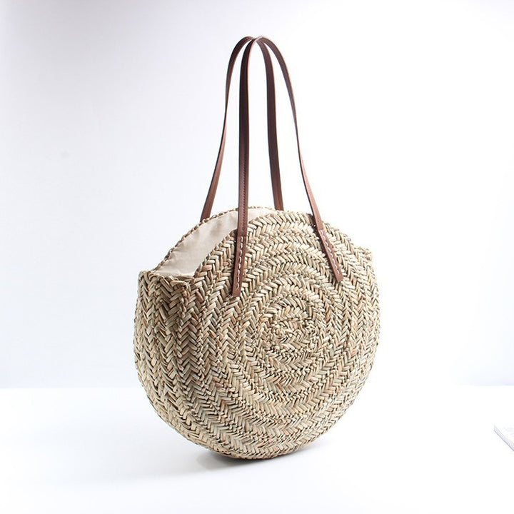 Braided straw beach bag with elegant leather handles Stornfield