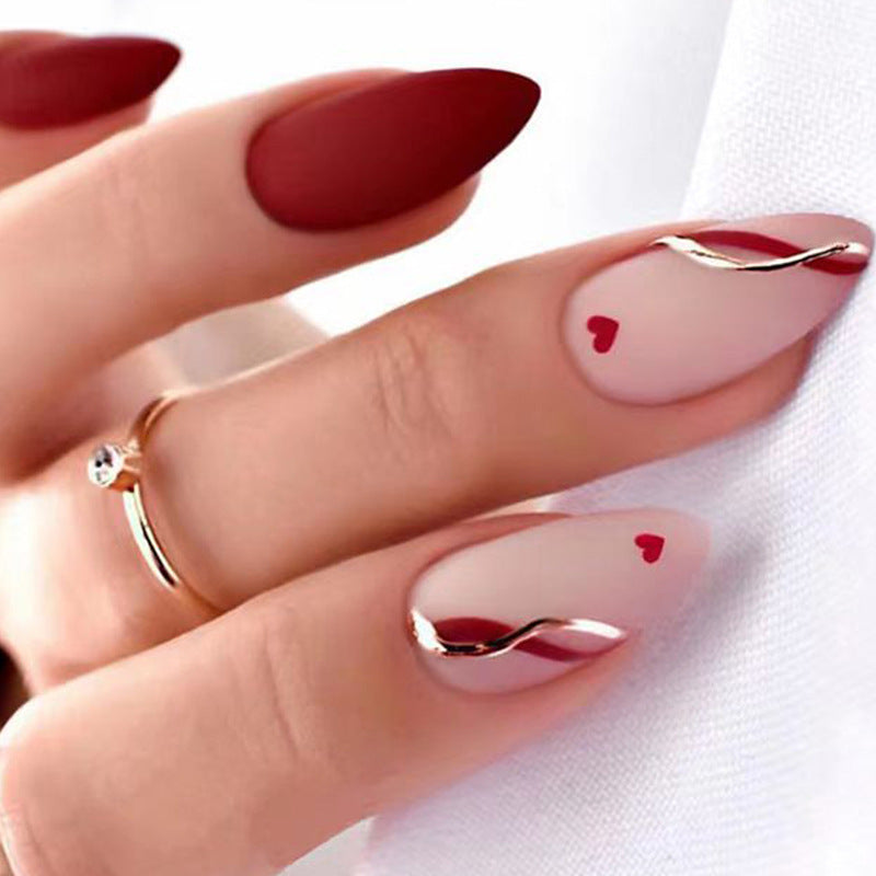 Artful and elegant artificial nails with heart decorations Stornfield