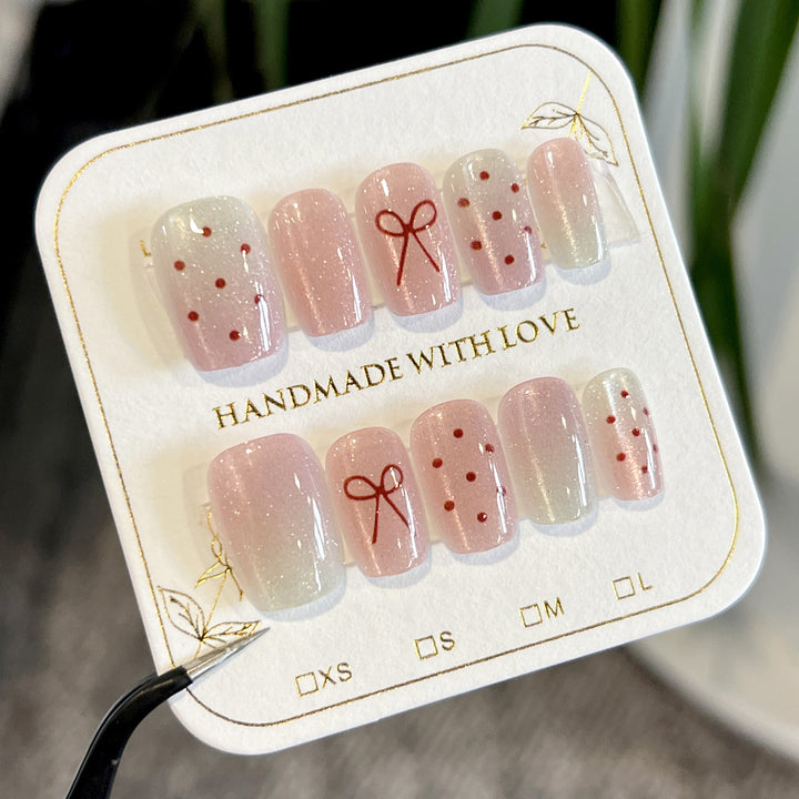 Artificial nail art with cute bow design Stornfield