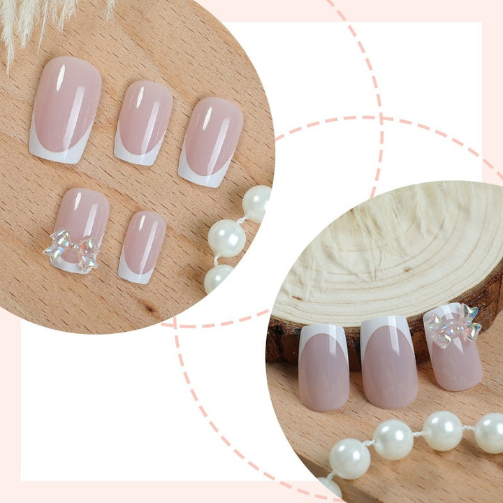 Elegant artificial nails with delicate glitter and decorative accents Stornfield