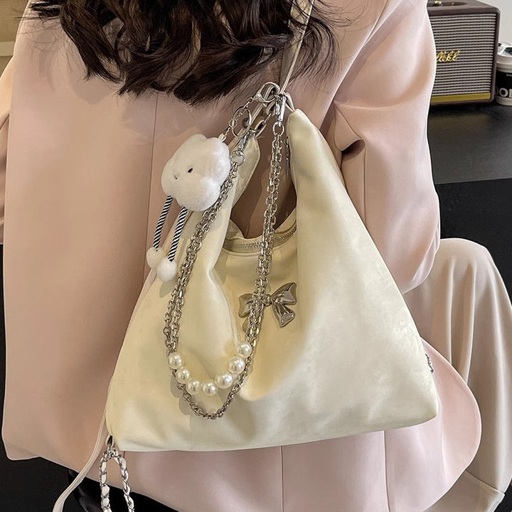 Fashionable handbag with unique pendant and chain accents Stornfield