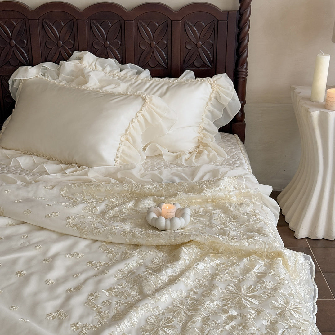 Elegant satin bedding set with double-layer chiffon ruffle and floral relief embroidery