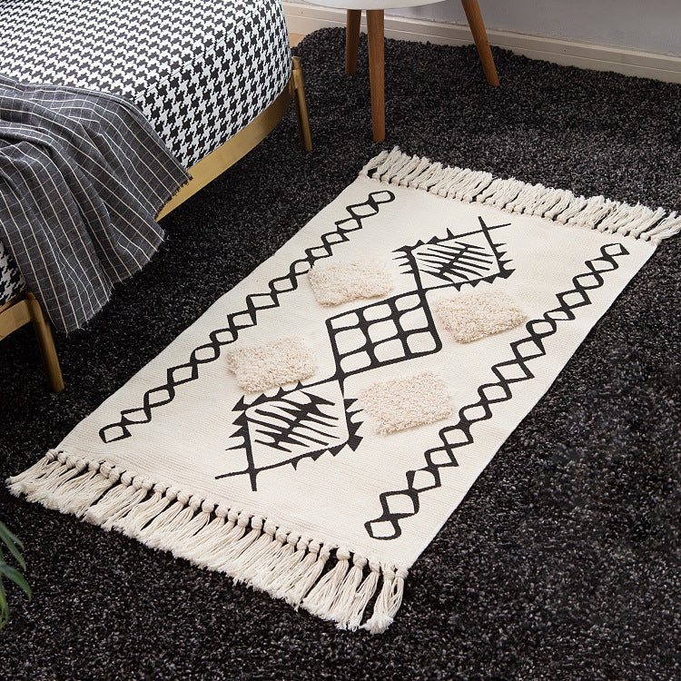 Handwoven cotton runner with pompom tufting and decorative fringes