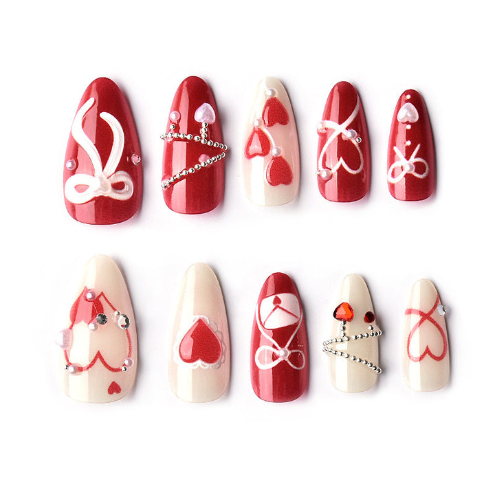 Glamorous artificial nail set with romantic heart design and elegant embellishments Stornfield