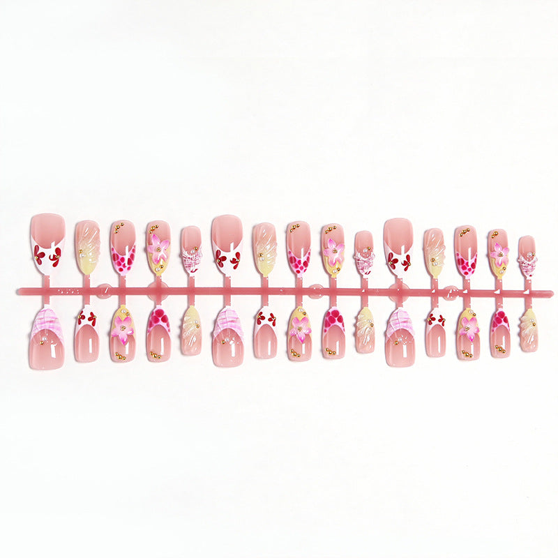 Artificial nails with floral accents and glitter decorations Stornfield