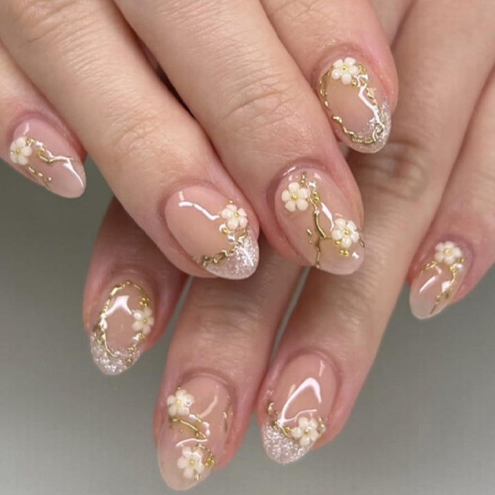 Creative nail art set with delicate flower decoration and glitter elements Stornfield