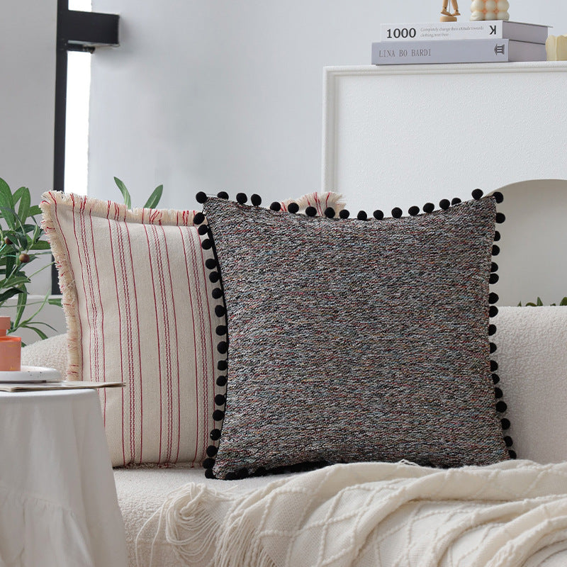 Playful decorative cushion with tassel edge
