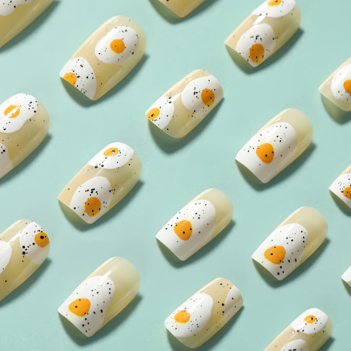 Artificial nails in creative fried egg design Stornfield