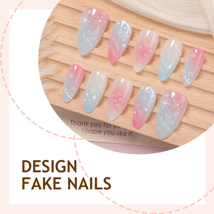 Acrylic nail set with elegant ombre design and floral decorations Stornfield