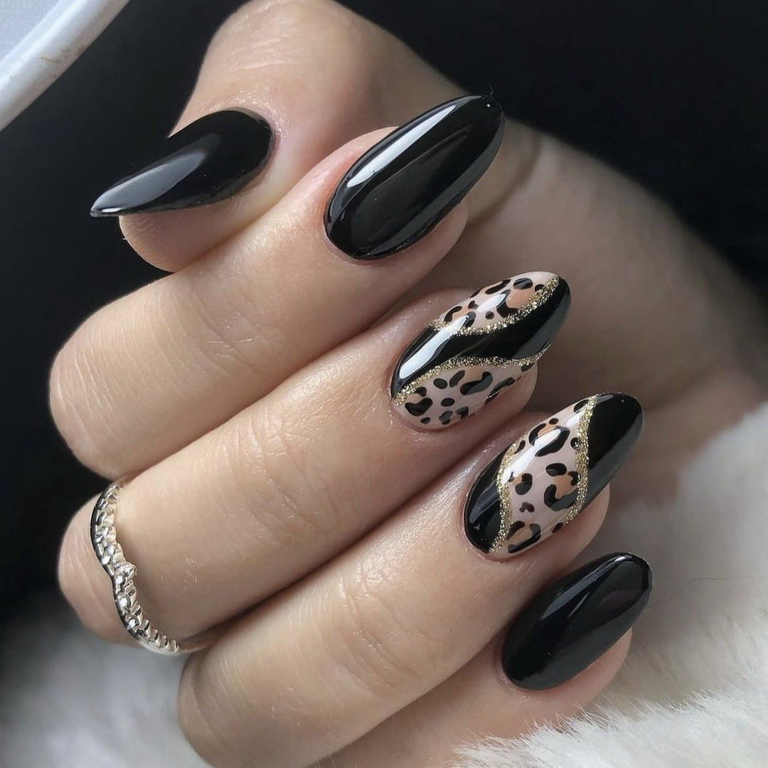 Artistic stiletto nails with leopard design and glitter effects Stornfield