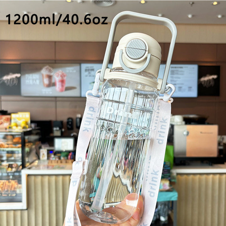 Women's large transparent drinking bottle with integrated carrying handle Stornfield