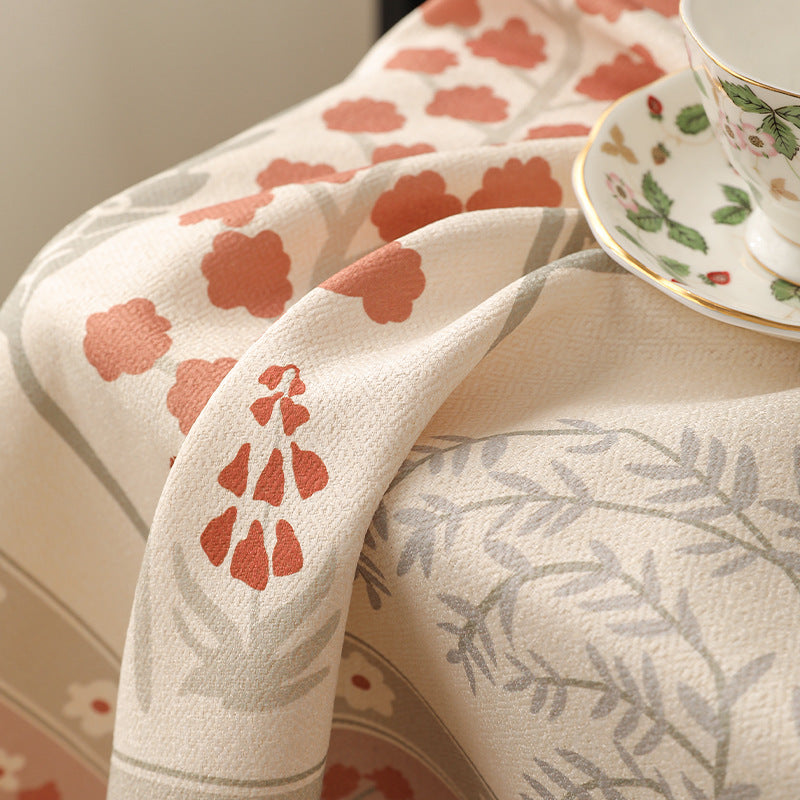 Rectangular easy-care tablecloth in floral jacquard with decorative border Stornfield