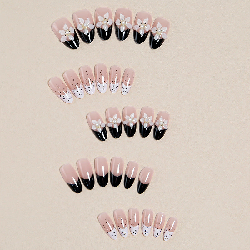 Artful nail tips with floral embellishments Stornfield
