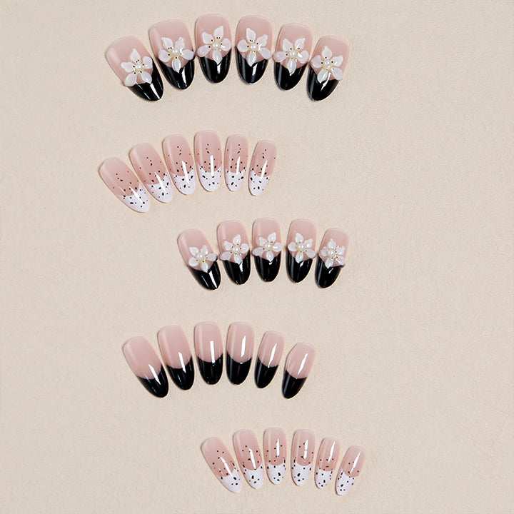 Artful nail tips with floral embellishments Stornfield