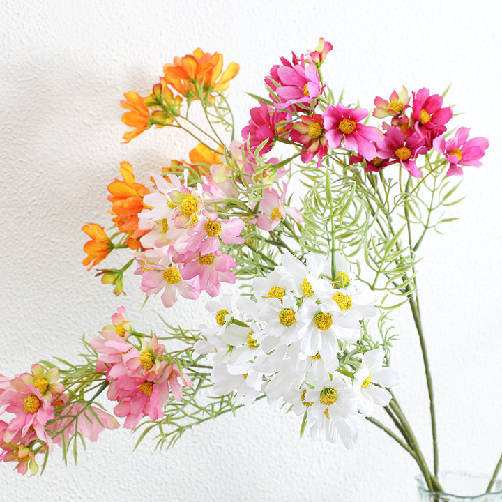 Artificial flower branch with bright pink flowers