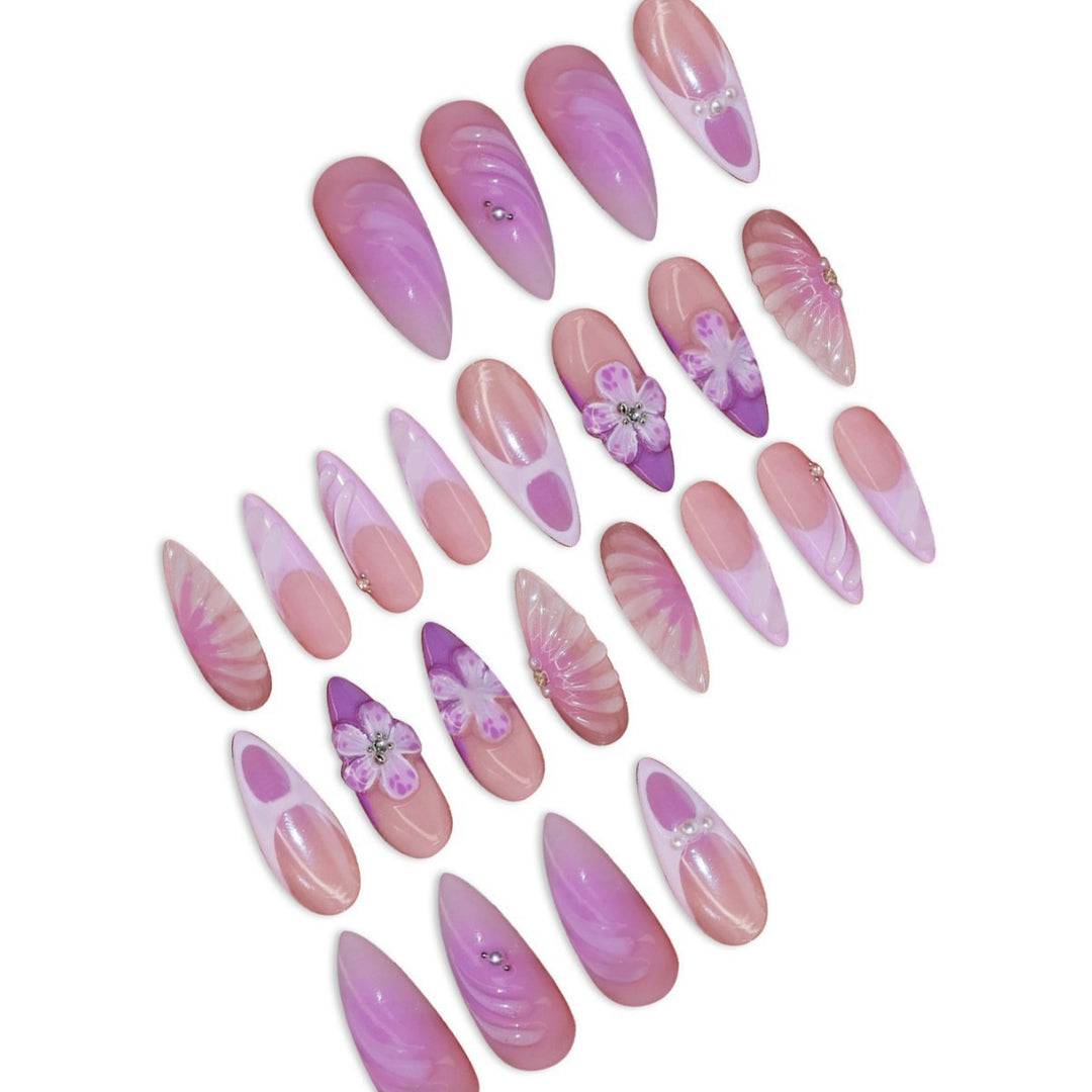 Artistic Stiletto Press-On Nail Art with Floral and Gemstone Accents Stornfield