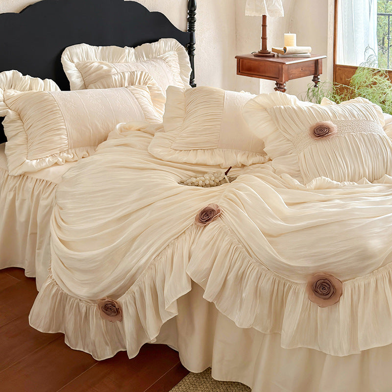 Romantic bedspread set with gathered satin look, frill, and rose appliqués