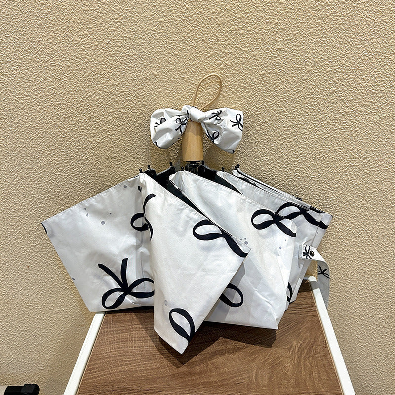 Women's foldable umbrella with elegant bow design Stornfield