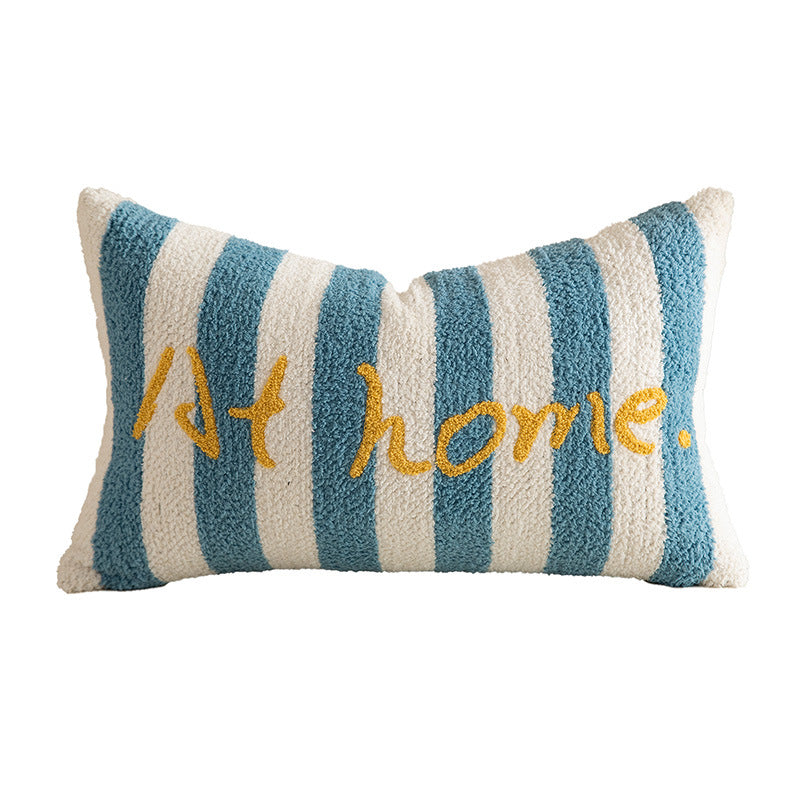 Striped bouclé decorative pillow with embroidered lettering and cuddly filling