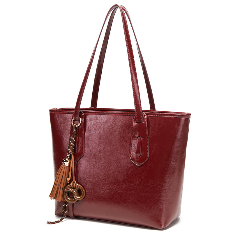Elegant Structured Handbag with Tassel Detail
