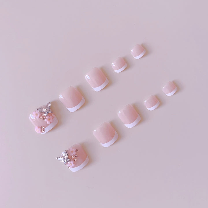 Acrylic nail set with elegant 3D flowers and glitter accents Stornfield