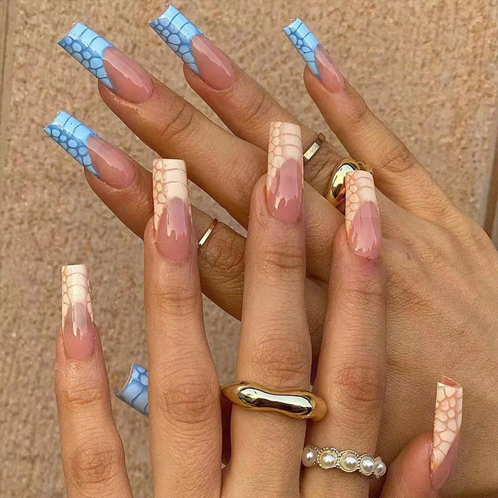 Artificial nail extensions with modern designs and creative color accents Stornfield
