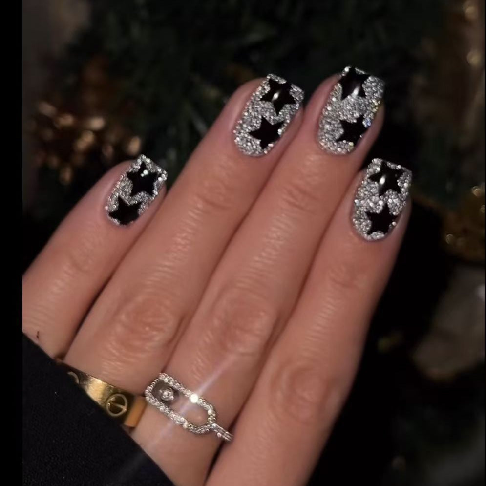 Artificial nail set with glamorous rhinestone embellishments and star motifs Stornfield