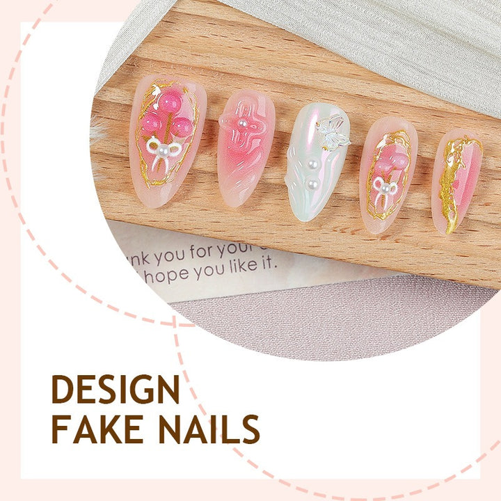 Acrylic nail set with stylish decorations and playful design Stornfield