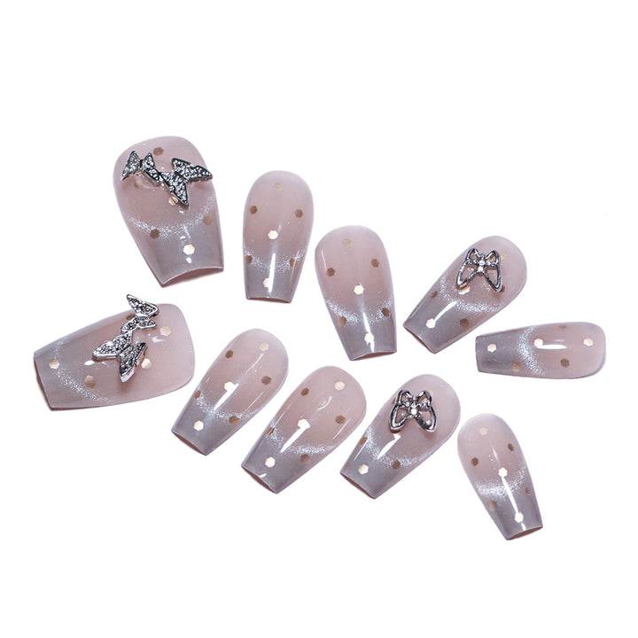 Artificial nail art with glitter details and bow accents Stornfield