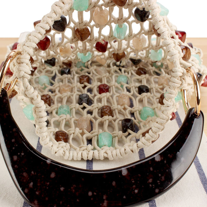 Fashionable handbag in creative net design with colorful accents Stornfield