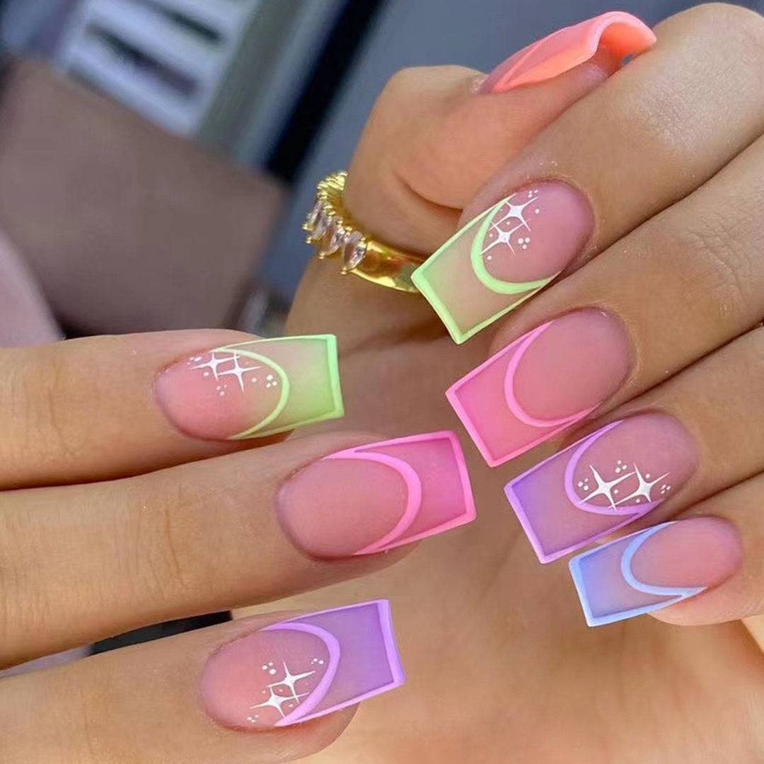 Acrylic nail set with colorful geometric designs and glitter accents Stornfield