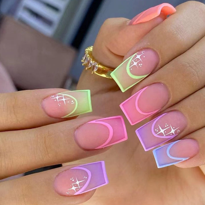 Acrylic nail set with colorful geometric designs and glitter accents Stornfield