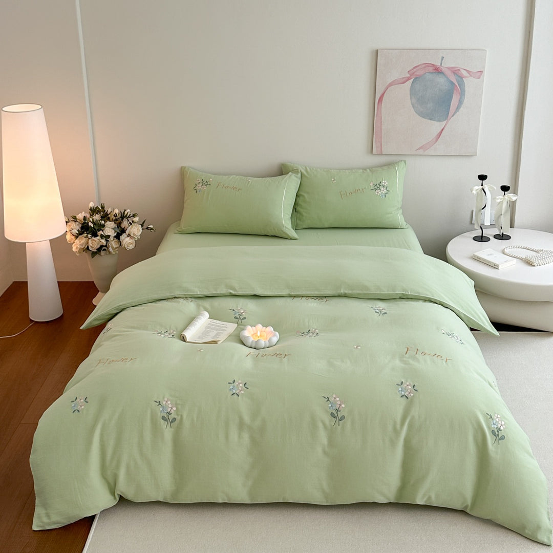 Delicate embroidered cotton bedding set with gentle botanical embroidery and bow ties Stornfield
