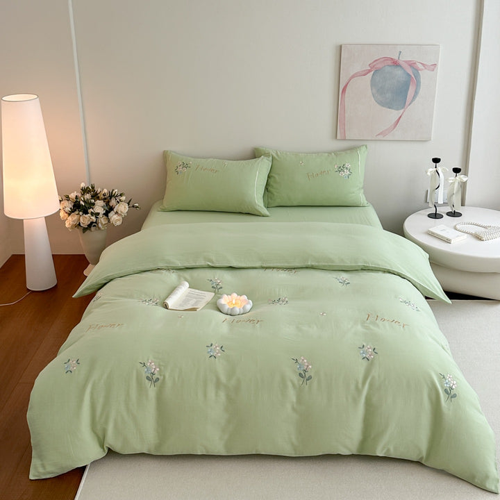 Delicate embroidered cotton bedding set with gentle botanical embroidery and bow ties Stornfield