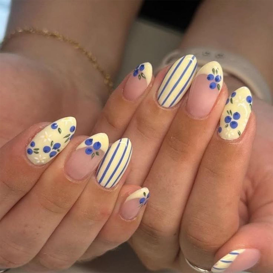 Artificial nail art with playful dots and bows Stornfield
